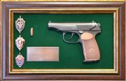 Decorative panel with Makarov pistol and FSB medals